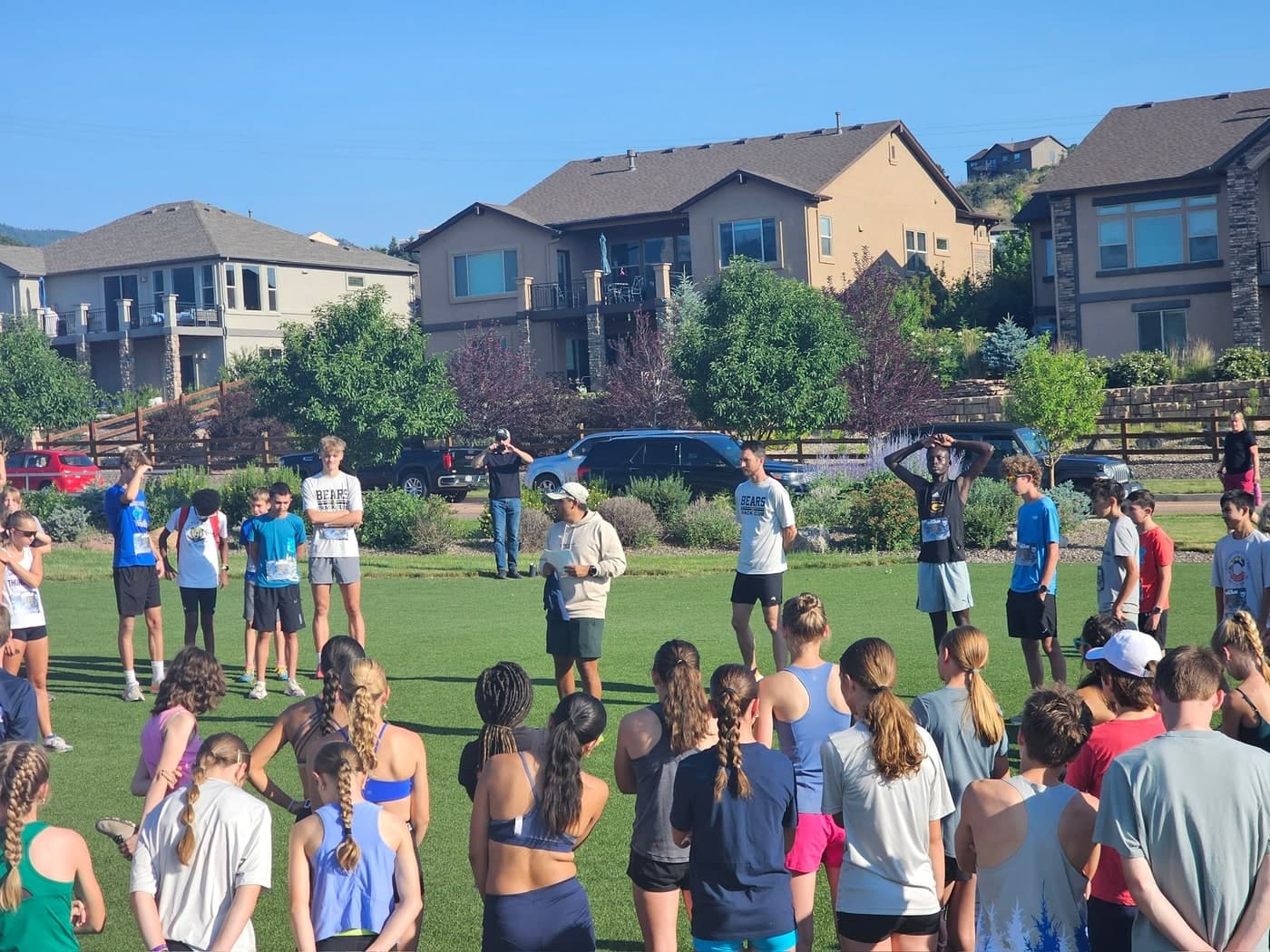 Luke Rodriguez addressing distance runners before a race